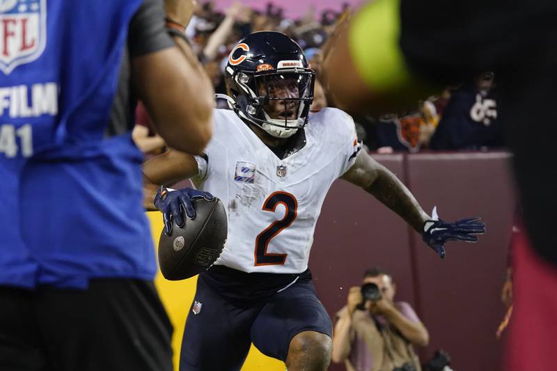 Chicago Bears wide receiver DJ Moore reacts after his touchdown catch against the Washington Commanders during the first half, Thursday, Oct. 5, 2023, in Landover, Md.