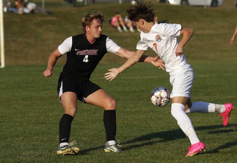Prairie Ridge's Seth Matson battles with Crystal Lake Central's Nathan Gray for the ball during a Fox Valley Conference soccer match on Thursday, Oct. 10, 2024, at Prairie Ridge High School.