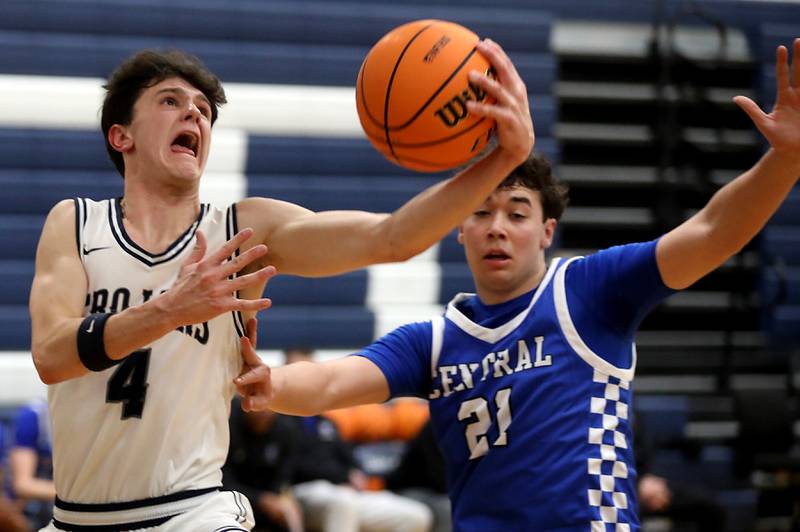 Cary-Grove's Dylan Dumele drives to the basket in front of Burlington Central's Markus Hansen during a Fox Valley Conference  boys basketball game on Wednesday Jan. 7,  2026, at Cary-Grove High School, in Cary.