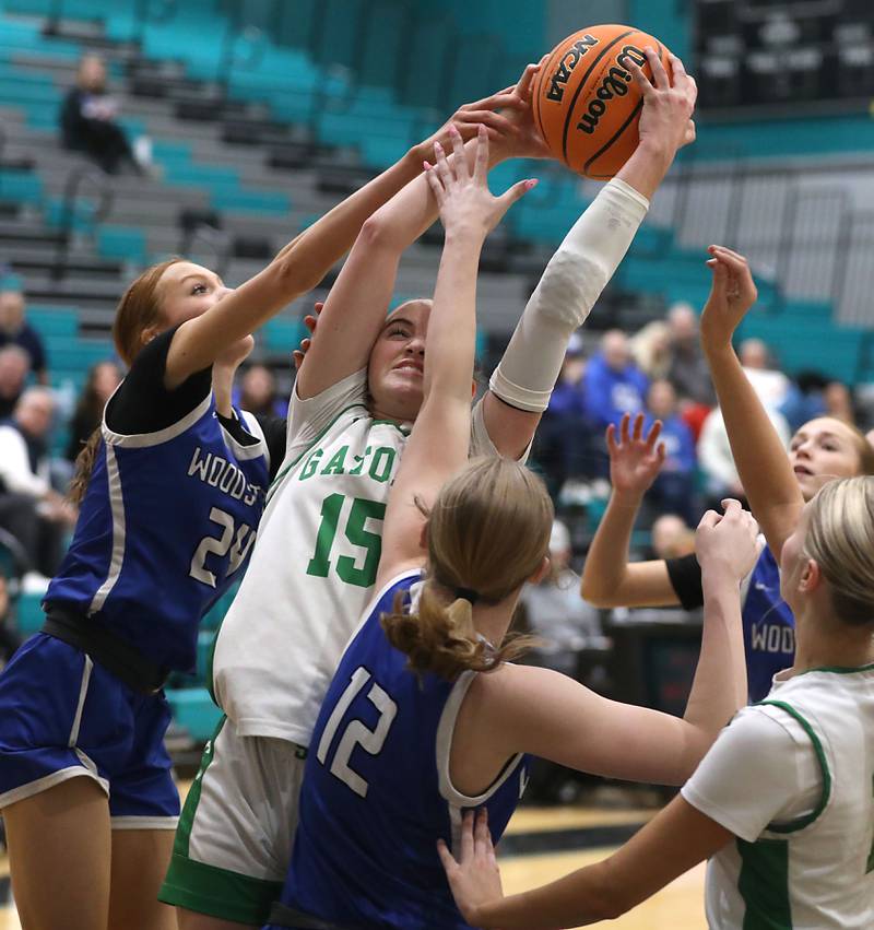 Crystal Lake South's Tessa Melhuish grabs a rebound between Woodstock's Aiyana Fourdyce (left) and Hayden Williams (right)  during the IHSA Class 3A Woodstock North Regional championship girls basketball game on Thursday, Feb. 19, 2026, at Woodstock North High School.