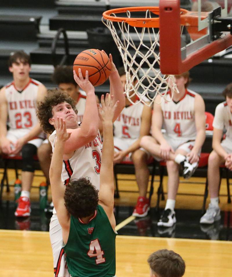 Hall's Payton Dye (32) looks to shoot a shot over L-P's Jack Jereb (4) on Tuesday, Nov. 29, 2022 at Hall High School in Spring Valley.