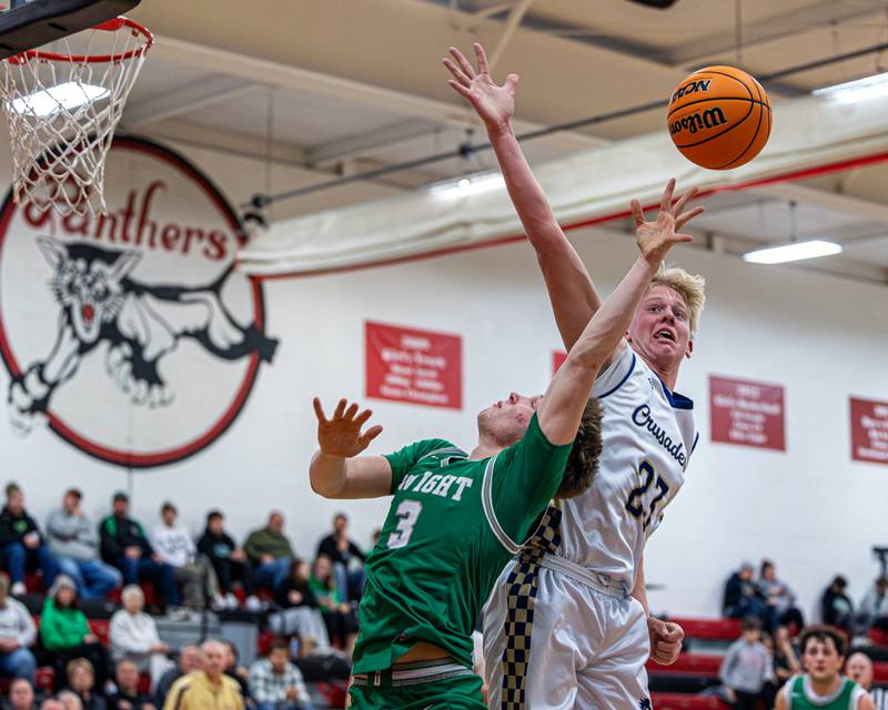 Luke McCullough (23) of Marquette blocks layup from Dwight's Collin Bachand (3) on Saturday, Feb. 21, 2026 at Marseilles Elementary School.