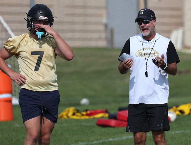 Sycamore head caoch Joe Ryan talks to his runningbacks Monday, Aug. 11, 2025, during their first fall practice at the school.