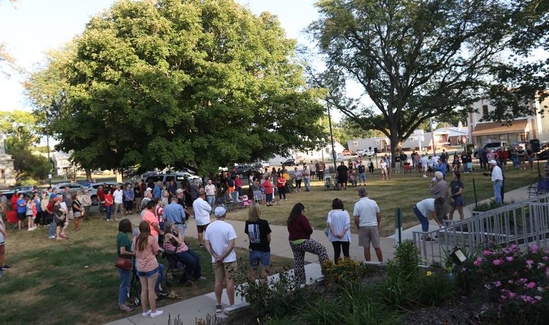 A large crowd of nearly 200 people gather during a vigil for Charlie Kirk on the front steps of the Bureau County Courthouse on Monday, Sept. 15, 2025 in Princeton.