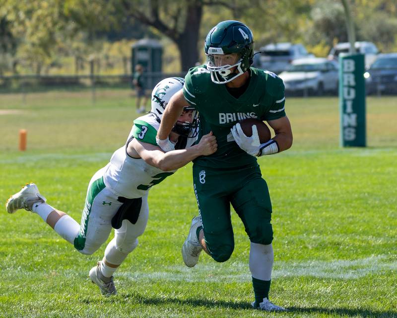 Aj Hermes (4) of St. Bede runs ball as Collin Bachand (3) of Dwight tries to bring him down on Saturday, Oct. 4, 2025 at Captain Thomas J. Heitmann field in Peru.