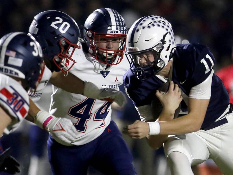 Cary-Grove's Jackson Berndt  looks for running rule agains the Belvidere North defense during an IHSA Class 5A quarterfinal playoff football game on Friday, November 14, 2025, at Cary-Grove High School, in Cary.