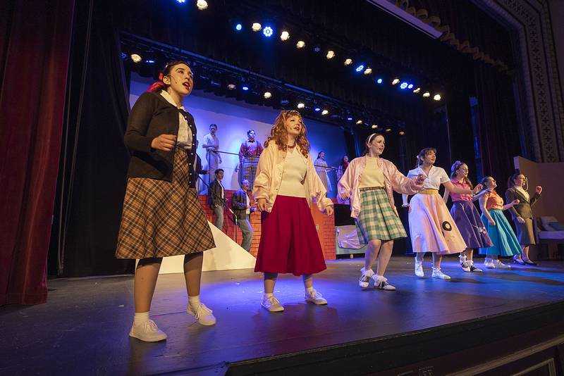 The cast of Dixon High School’s Grease rehearse their opening number Wednesday, March 12, 2025, at the school.