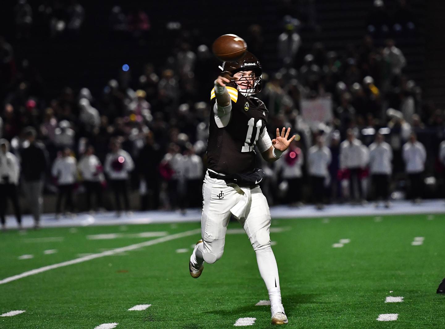 Joliet Catholic's Lucas Simulick (11) passes the ball during the conference game against Providence Catholic on Friday, OCT. 24, 2025, at Joliet.