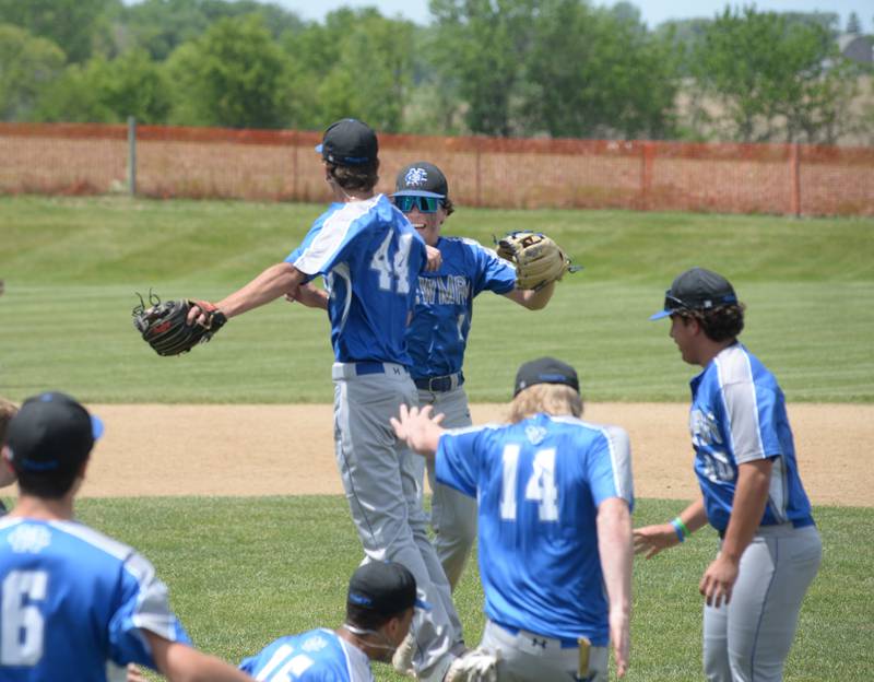 Newman's Kyle Wolfe and Garret Matznick celebrate after the final out during the championship game with Dakota at the 1A Pearl City Sectional on Saturday, May 27.