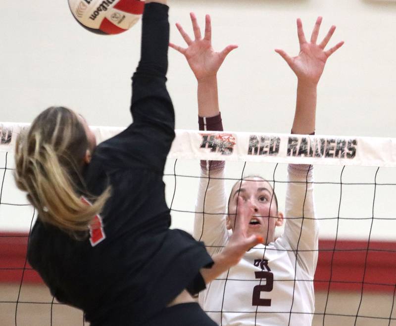 Prairie Ridge’s Addi Smith, right, blocks against Huntley’s Mia Jacobelli in varsity girls volleyball at Huntley High School in Huntley on Thursday, Sept. 11, 2025.