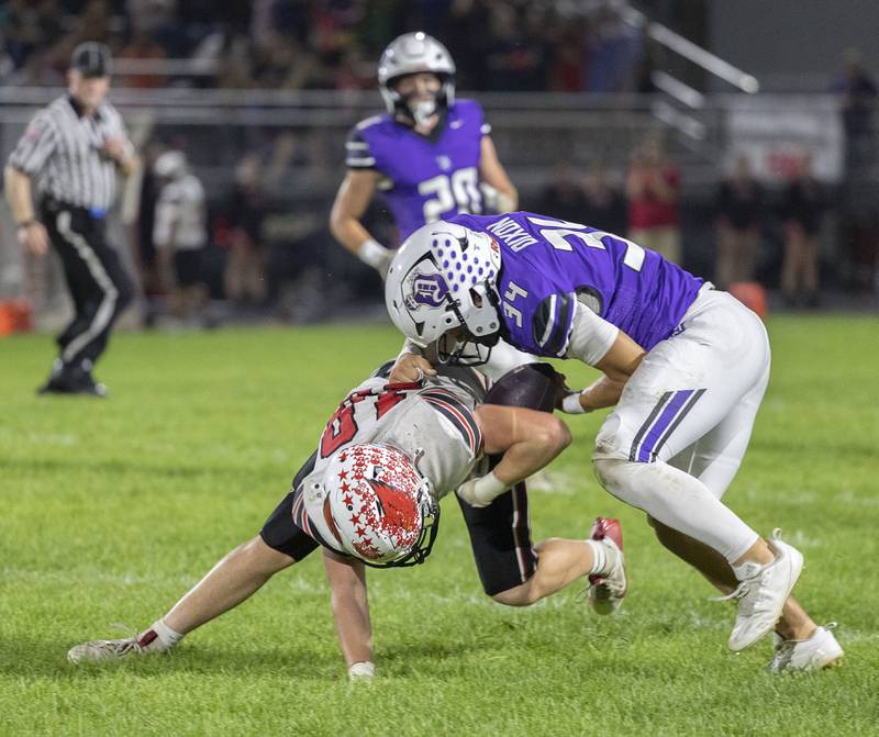 Dixon’s Owen Belzer strips a Stillman Valley receiver of the ball Friday, Oct. 3, 2025.