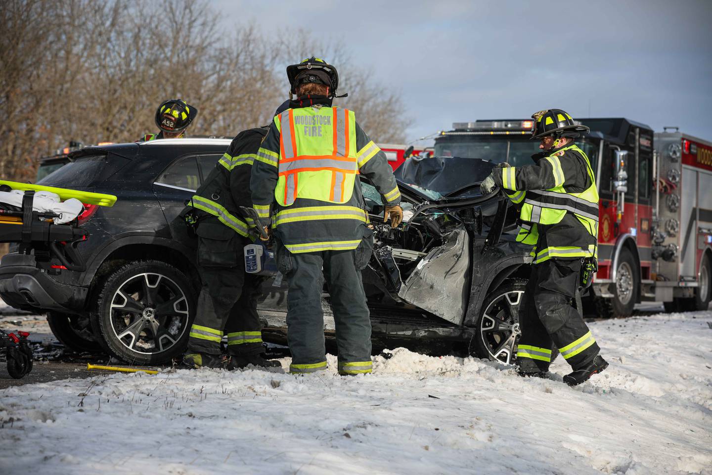 First responders work the scene of a crash on Sunday, Feb. 16, 2025, on Route 14 in Woodstock where one person died and five others were injured/