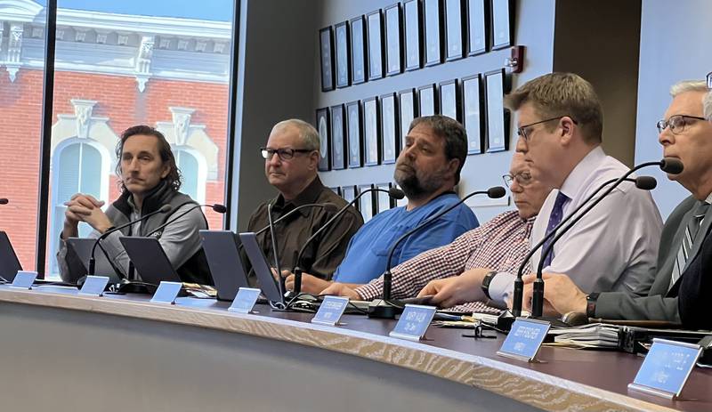 (From left to right) Sycamore First Ward Aldermen Josh Huseman and Alan Bauer, Second Ward Aldermen Pete Paulsen and Chuck Stowe, Sycamore City Manager Michael Hall and city attorney Keith Foster listen to a presentation during a Sycamore City Council meeting on March 20, 2023.