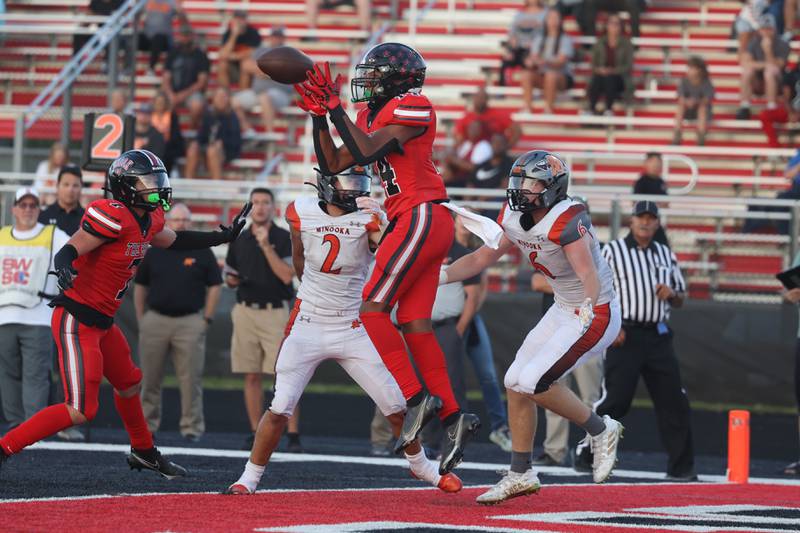 Bolingbrook’s Tavarez Edwards intercepts the ball in the end zone against Minooka. Friday, Aug. 26, 2022, in Bolingbrook.