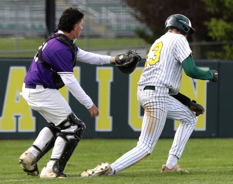 Hampshire's Cameron Ortega tags out Crystal Lake South's Trevor Walker after he slipped and got caught in a run down between home and third bases during a Fox Valley Conference baseball game on Monday, April 29, 2026, at Crystal Lake South High School.