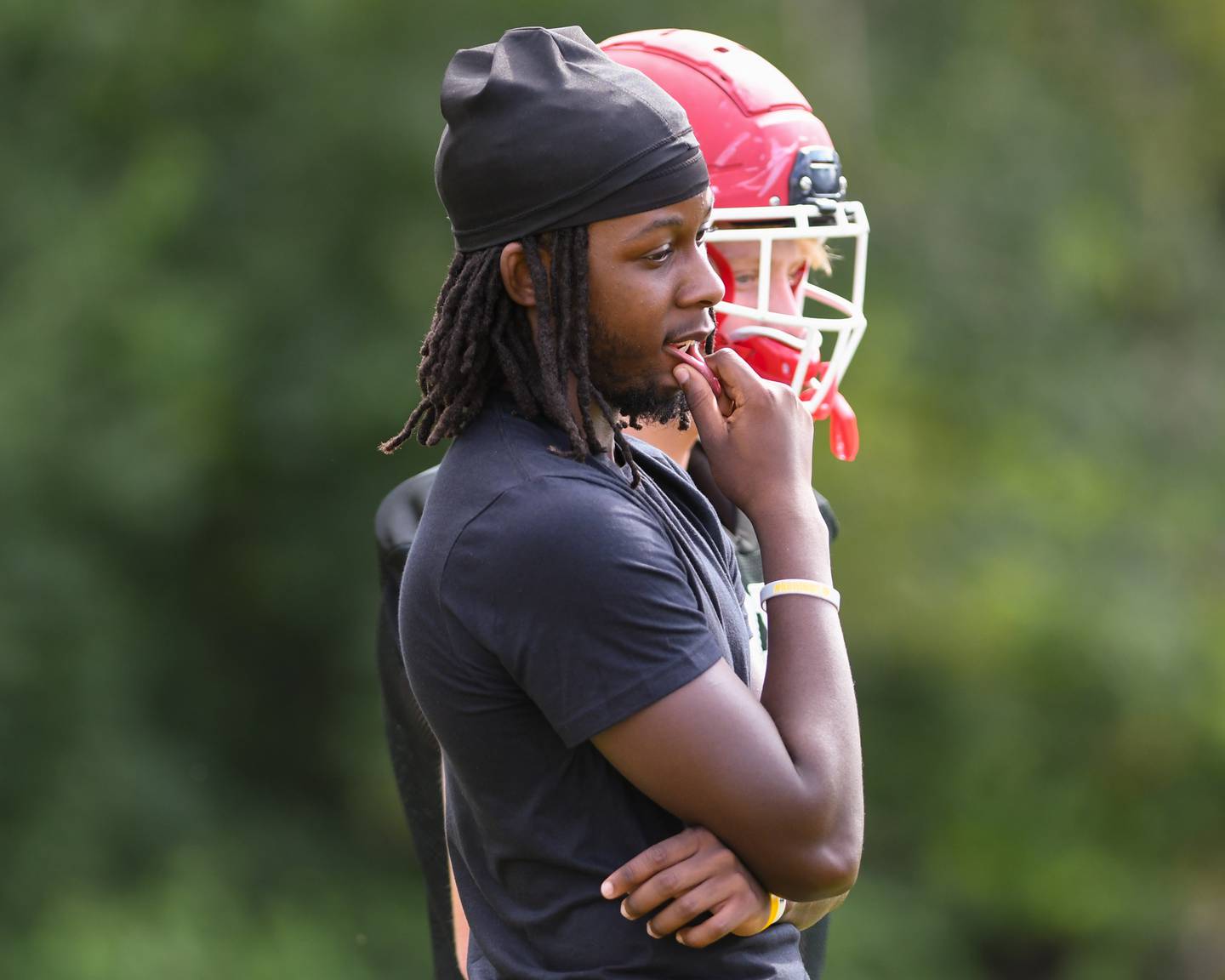 Yorkville’s Bryce Griffin  listens to what his coach has to say during practice on Aug. 19, 2024, held at Yorkville High School.