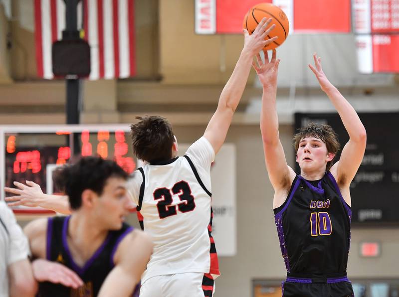 Benet’s Edvardas Stasys (23) blocks a shot by Downers Grove North’s Bobby Grganto (10) during the Class 4A Benet Sectional championship game on March 7, 2025 at Benet Academy in Lisle.
