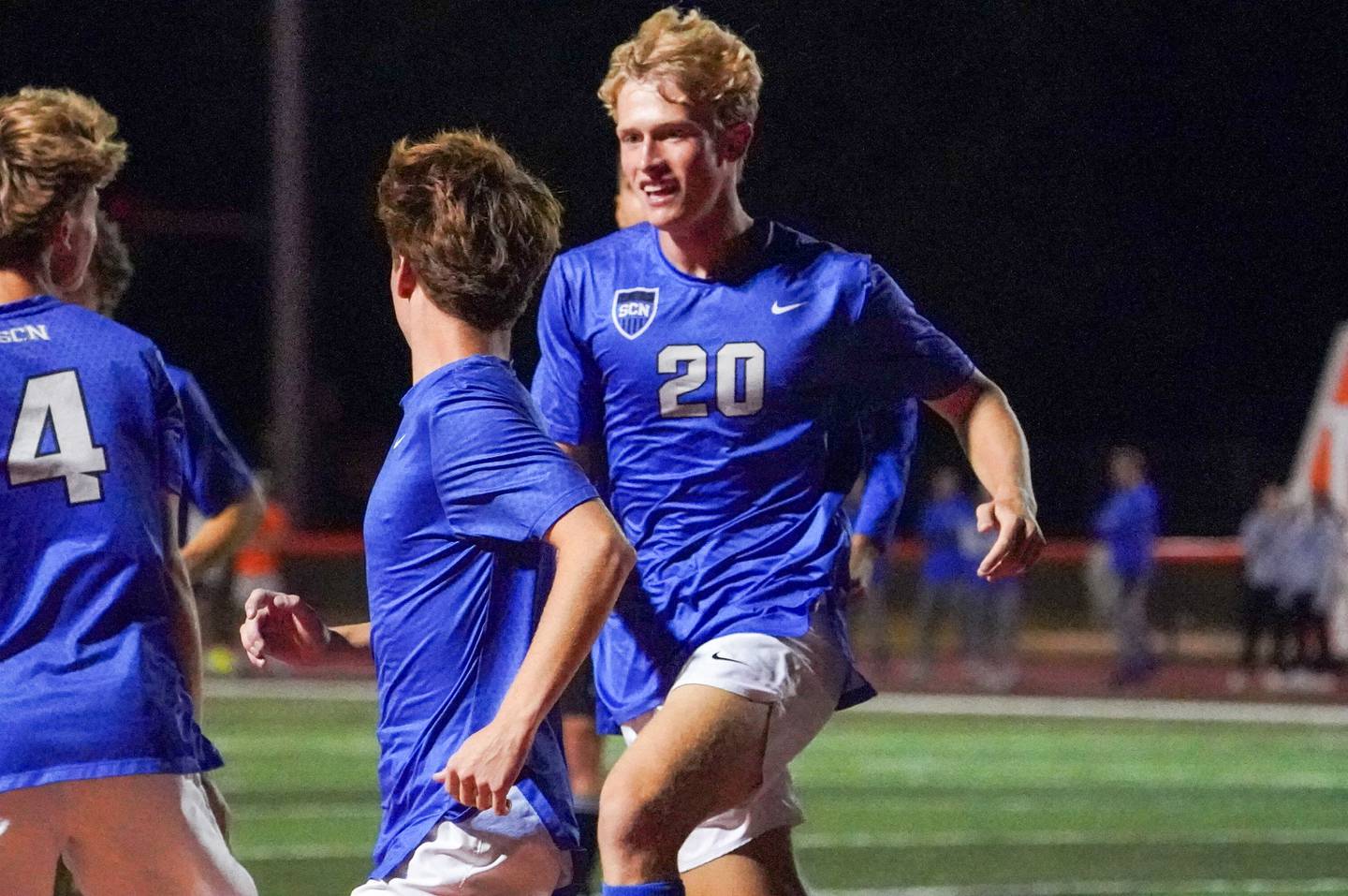 St. Charles North's Eddy Torres (20) smiles after scoring a goal against St. Charles East during a soccer match at St. Charles East High School on Thursday, Sep 26, 2024.