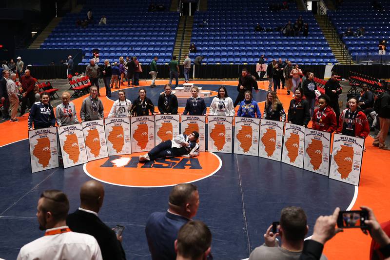 All the weight class champions pose for a photo after the title matches at Grossinger Motor Arena in Bloomington. Saturday, Feb. 26, 2022, in Champaign.