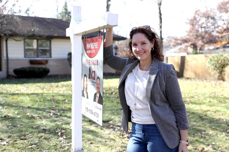 Realtor Anne Kothe at one of her listings in Geneva.