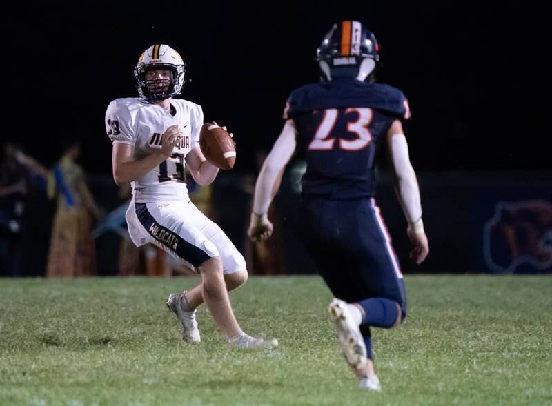 Neuqua Valley's Mark Mennecke (13) drops back in the pocket against Oswego during a football game at Oswego High School on Friday, Aug 26, 2022.