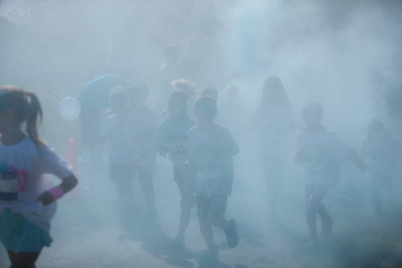 Kids run through the colors at the Glen Ellyn 2K Kids Color Bash Run on Saturday Aug.10, 2024 at Ackerman Park in Glen Ellyn.