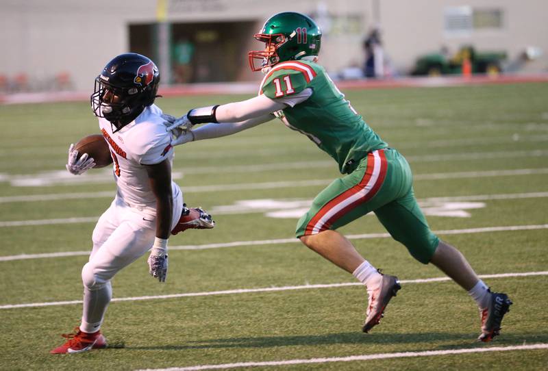 Metamora's Jaiduan Cranford runs around L-P's Kaleb Kennedy on Friday, Sept. 1, 2023 at Howard Fellows Stadium.