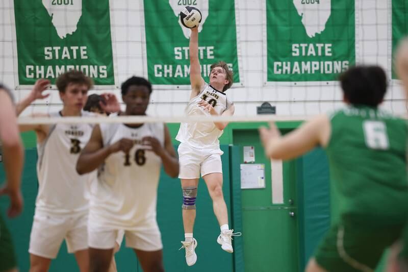 Joliet West’s Michael Meloy serves the ball against Providence on Tuesday, April 16, 2024 in New Lenox.