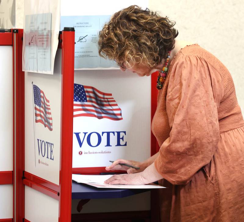 Shaw Local June 2022 file photo – Peggy Carey, from DeKalb, takes advantage of the early voting period Thursday, May 19, 2022, at the polling place in the DeKalb County Legislative Center in Sycamore. A virtual candidate election forum took place Tuesday, Oct. 13, and featured candidates for DeKalb County Board ahead of the Nov. 8, 2022 election.