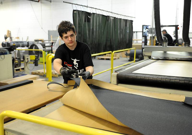 Tim Kasper, a rising senior at Cary-Grove High School, moves material as he works as an intern Friday, June 10, 2022, at Jessup Manufacturing in McHenry. The Manufacturing Pathways Consortium in McHenry County launched a new paid internship this summer that is looking to train current and recent high school students in various manufacturing skills in effort to help expand the pipeline of quality manufacturing workers in the county.