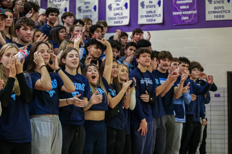 The Downers Grove South student section cheers on the team during basketball game between Downers Grove South at Downers Grove North. Dec 16, 2023.