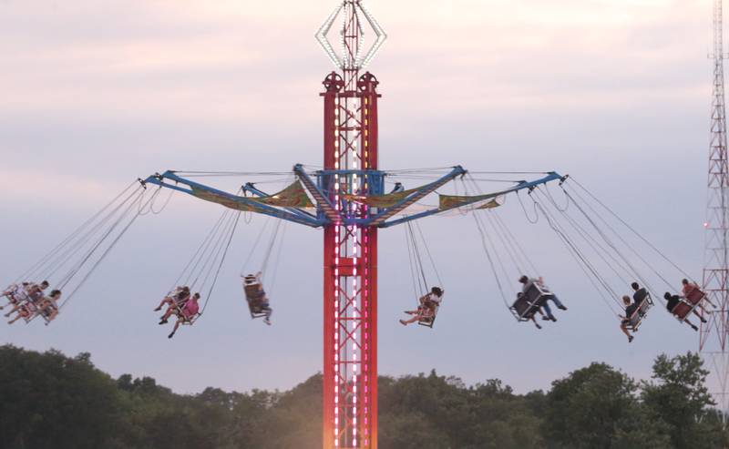 Kids ride the giant swing ride during the 168th annual Bureau County Fair on Saturday, Aug. 26, 2023 in Princeton.