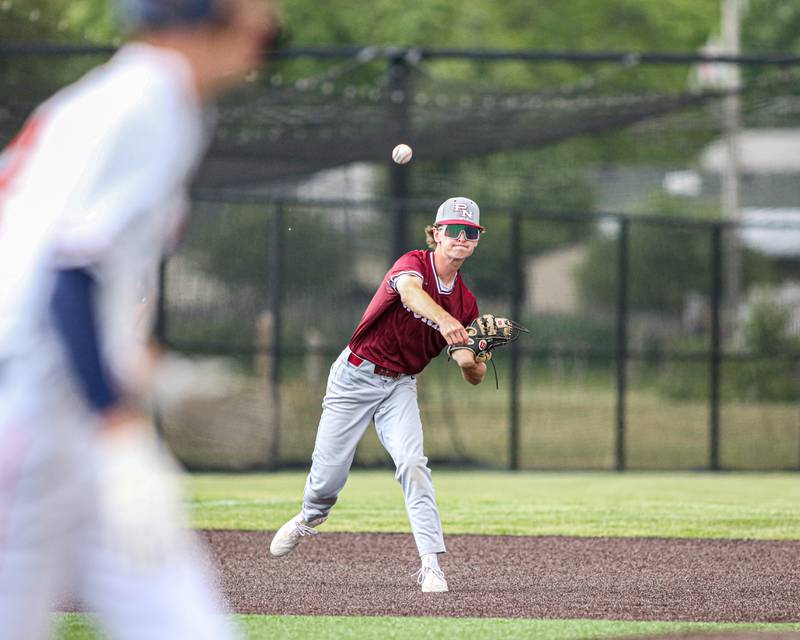 Plainfield North's Ryan Nelson (5) throws out the runner at first during Class 4A Romeoville Sectional semifinal game between Plainfield North at Oswego.  June 1, 2023.