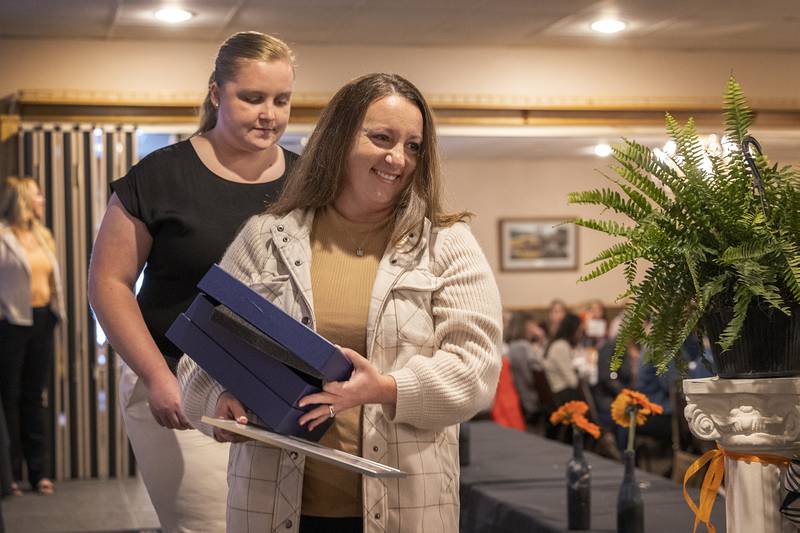 Emily Zimmerman leaves the stage after having been awarded the Pearl Woods Award Thursday, April 18, 2024, at the YWCA Women of Achievement Luncheon. The award goes to a woman who has demonstrated achievement in areas of industry or private business.