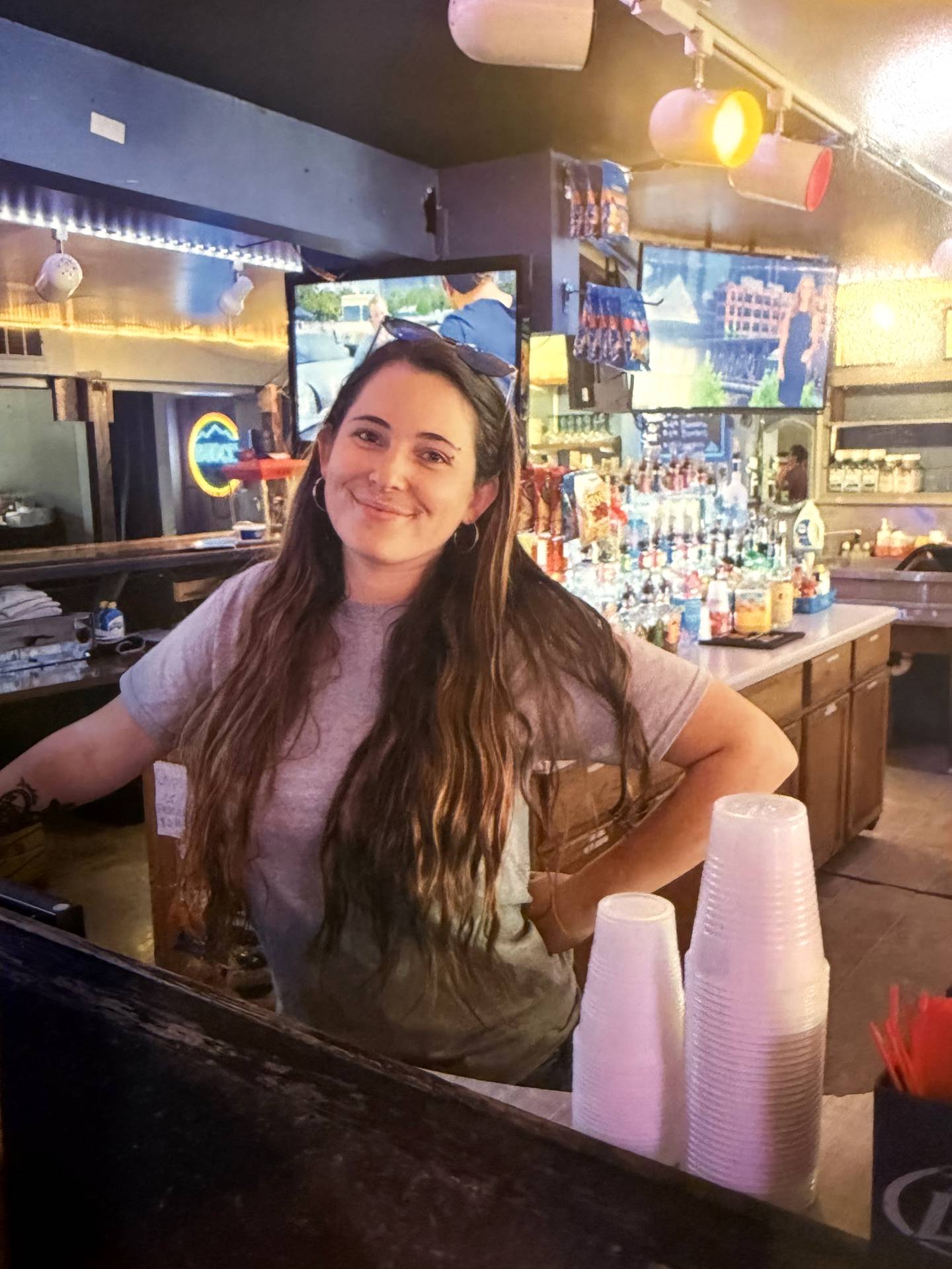 Courtney Drysdale stands behind the bar at The Line, which she owned, in rural Momence. Drysdale, 30, was shot and killed Feb. 2 in an alleged robbery turned homicide.