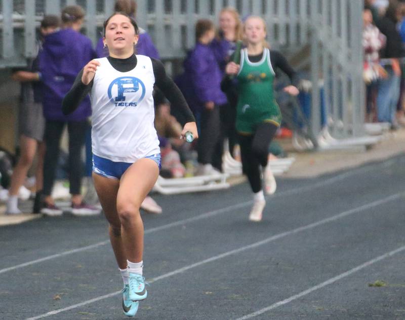 Princeton's Miyah Fox sprints down the track in the 4x200 meter relay during the Class 2A girls track and field Sectional on Thursday, May 9, 2024 in Princeton.