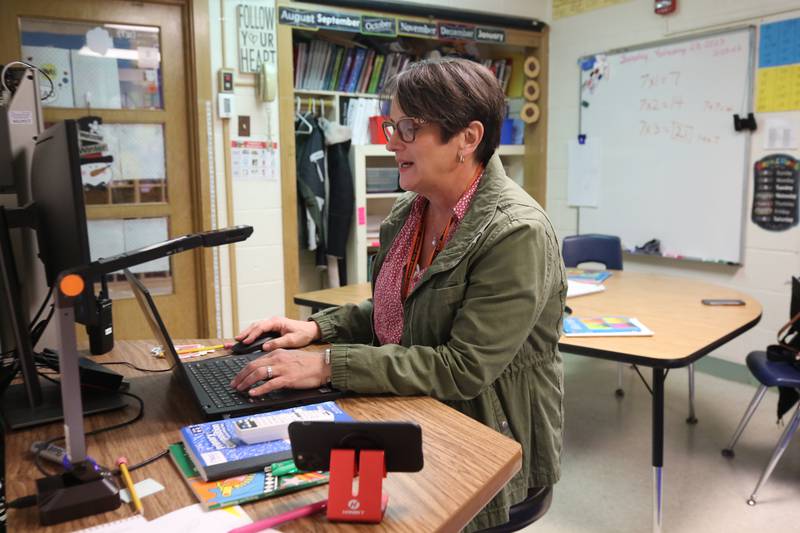 Mary Lynn Buckner, longtime special education teacher at Littlejohn Elementary School, works on her computer Wednesday, Feb. 23, 2023, in her classroom at the school in DeKalb.