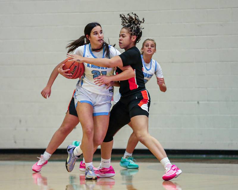 St Charles East's Corinne Reed (35) defends Prospect's Gina Falls (21) at the York Thanksgiving Tournament. Nov 13, 2023.
