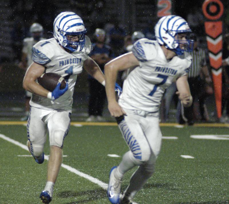 Princeton's  Casey Etheridge follow a block by Gavin Lanham. Newman Central Catholic H.S hosted Princeton H.S. in a non-conference football game at Sterling H.S, on Friday, August 29, 2025.