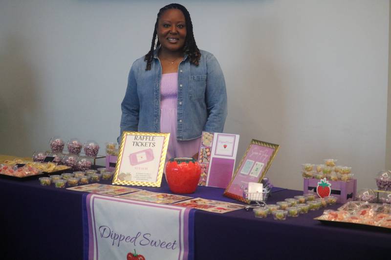 India Washington is all smiles ahead of her graduation Monday, June 2, 2025, from Breakthrough Community Business Academy's spring 2025 cohort. As part of the ceremony, she ran a booth for her business, Dipped Sweets, to meet and greet with guests.