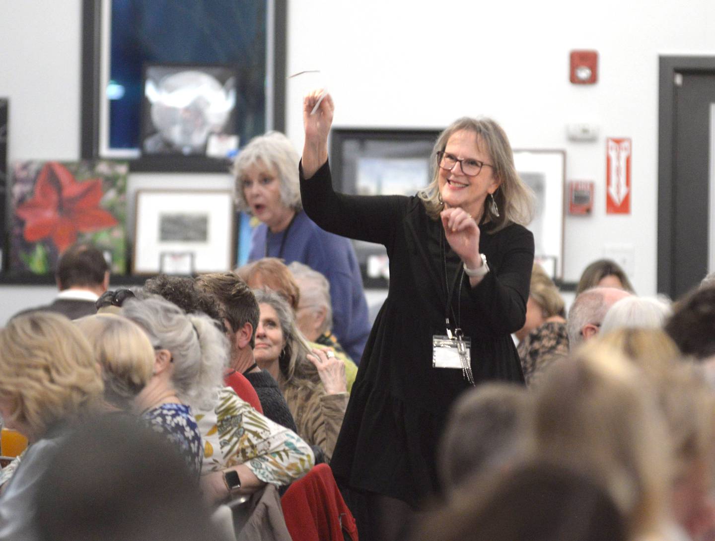 Jan Conkrite of Woosung reacts as her number is selected at random allowing her to choose an art piece during the Serenity Hospice and Home’s Fourth Annual Art Dash fundraiser on Wednesday, April 9, 2025, at River’s Edge Experience, 103 S. First St., Oregon. Conkrite is also an artist who donated an oil on canvas painting to this year's event.