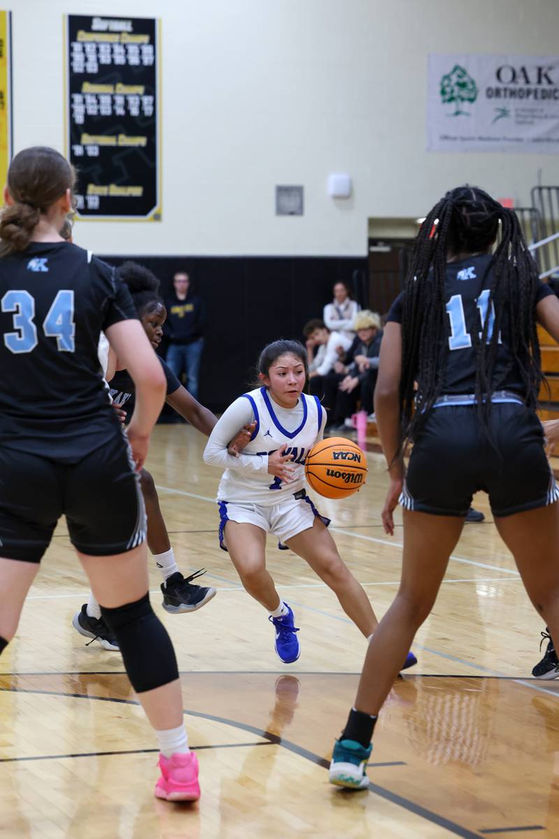 Rosary's Aleah Luna maneuvers between Kankakee defenders to pass during the Kays' 75-28 victory over Rosary at the Reed-Custer Classic on Monday, Nov. 17, 2025.