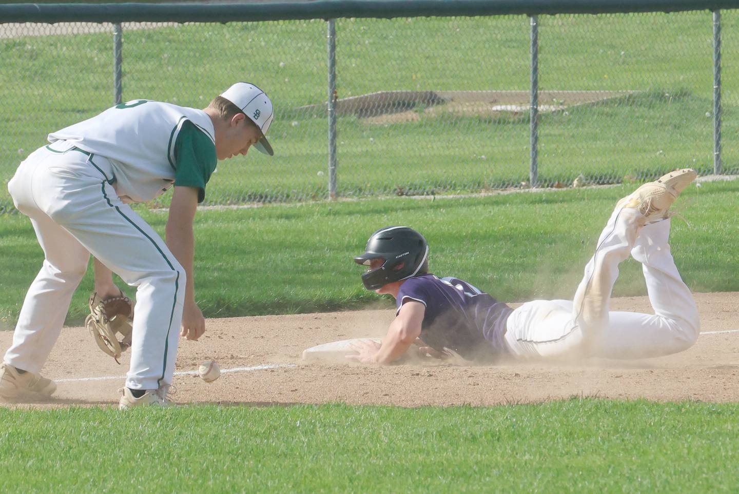 St. Bede's Carson Riva drops the ball at third base as Serena's Tucker Witeaker slides safely into the bag on Friday, April 24, 2026 at St. Bede Academy.