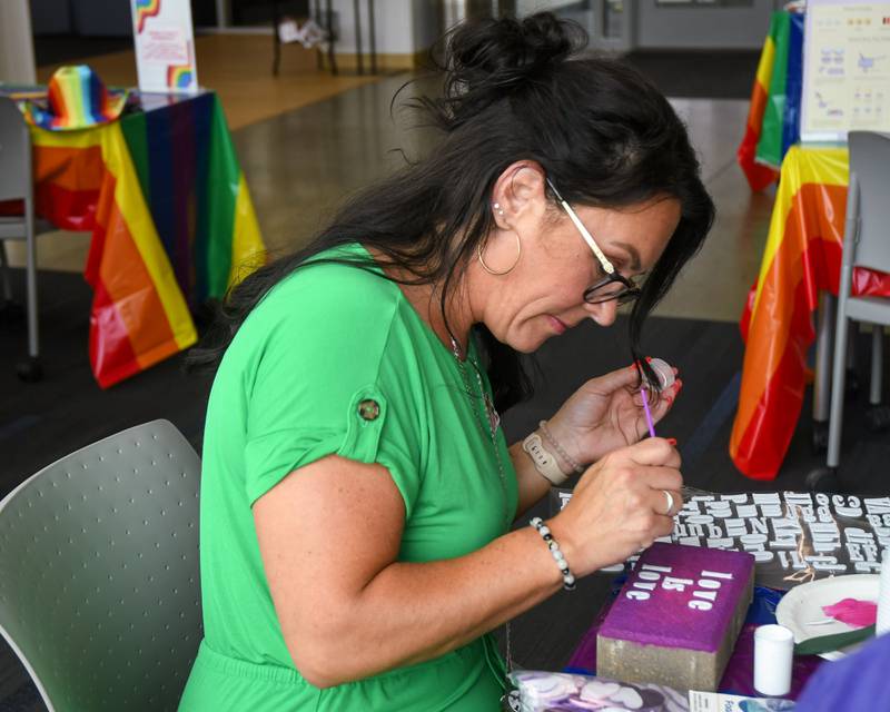 Stacy Wendt the Administrative Coordinator Employee Development for Waubonsee Community College decorates a brick for pride month during the pride party held at the Plano campus held on Thursday June 29, 2023.