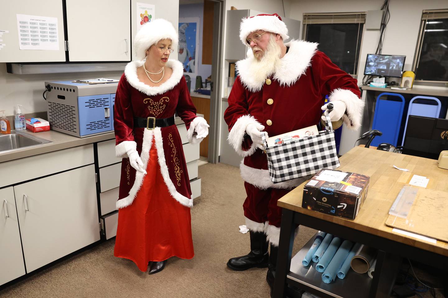 Amy Hibbard and Gerald Curl get ready to meet the children’s as Mr. and Mrs. Claus at the Shorewood-Troy Public Library.
