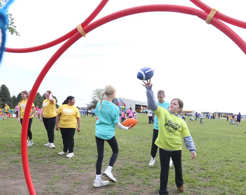 Tiegan Mcnutt of Nortwest School in La Salle, throws a football through a hoop during the Wallace Warrior Games on Friday, May 8, 2026 at Wallace Grade School. The unified event promoted inclusiveness, friendships and fun. 25 schools and over 400 kids from La Salle, Bureau and Putnam Counties participated in the event.