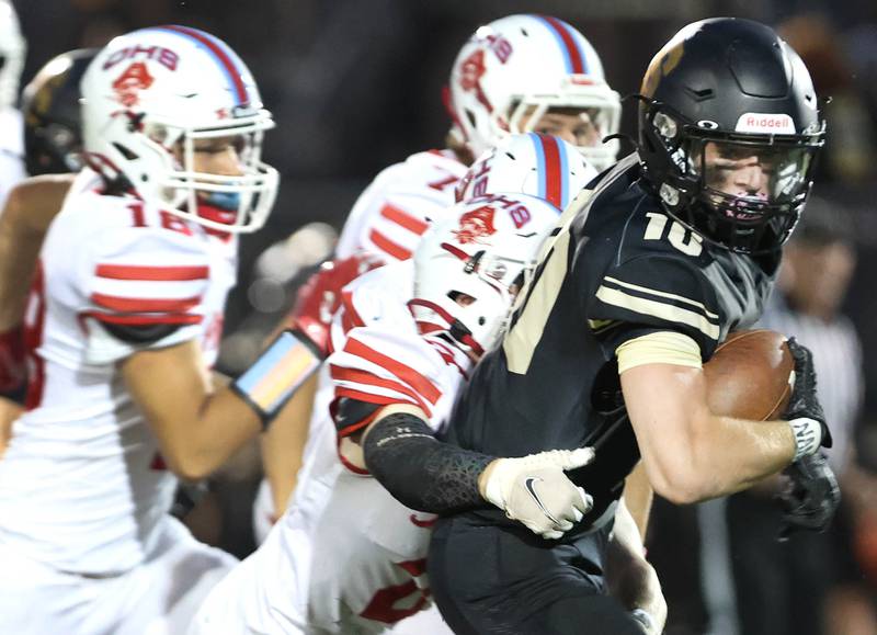 Sycamore's Zack Crawford tries to pull away from an Ottawa defender during their game Friday, Sept. 16, 2022, at Sycamore High School.
