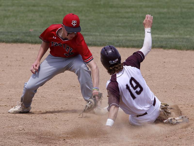 Timothy Christian’s Fletcher Roemmich tags out Richmond-Burton’s Joseph Mrowiec at second base during a IHSA Class 2A supersectional baseball game between Richmond-Burton and Timothy Christian at the Rockford Rivets Stadium in Rockford.