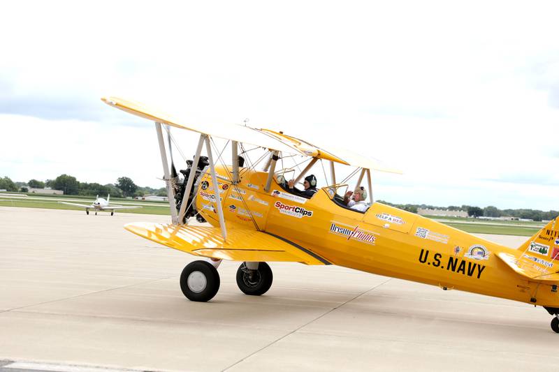 Guy Prisco, 93, a resident of Covenant Living at the Holmstad in Batavia, (left) and pilot Darryl Smith prepare to take off for a Dream Flight at the DuPage Airport in West Chicago on Saturday, July 29, 2023. The plane is a 1942 open cockpit Boeing Stearman, the same airplane used to train military aviators in the 1940s. The flights were courtesy of Ageless Aviation Dreams Foundation, a non-profit organization to honor U.S. military veterans living in long-term care facilities. Prisco was a First Lieutenant with the Army Corps of Engineers in the 1950s.