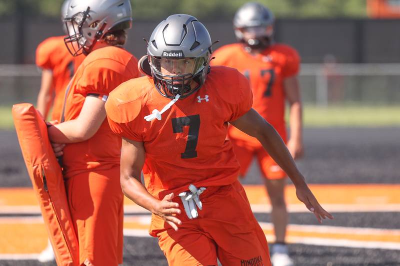 Minooka Inside Linebacker Isaiah Dupree runs a defensive drill during practice. Wednesday, Aug. 10, 2022, in Minooka.